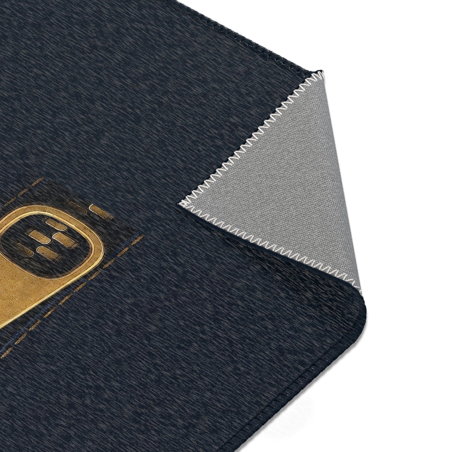 A close-up graphic of a metallic gold zipper opening up dark navy denim fabric - area rug