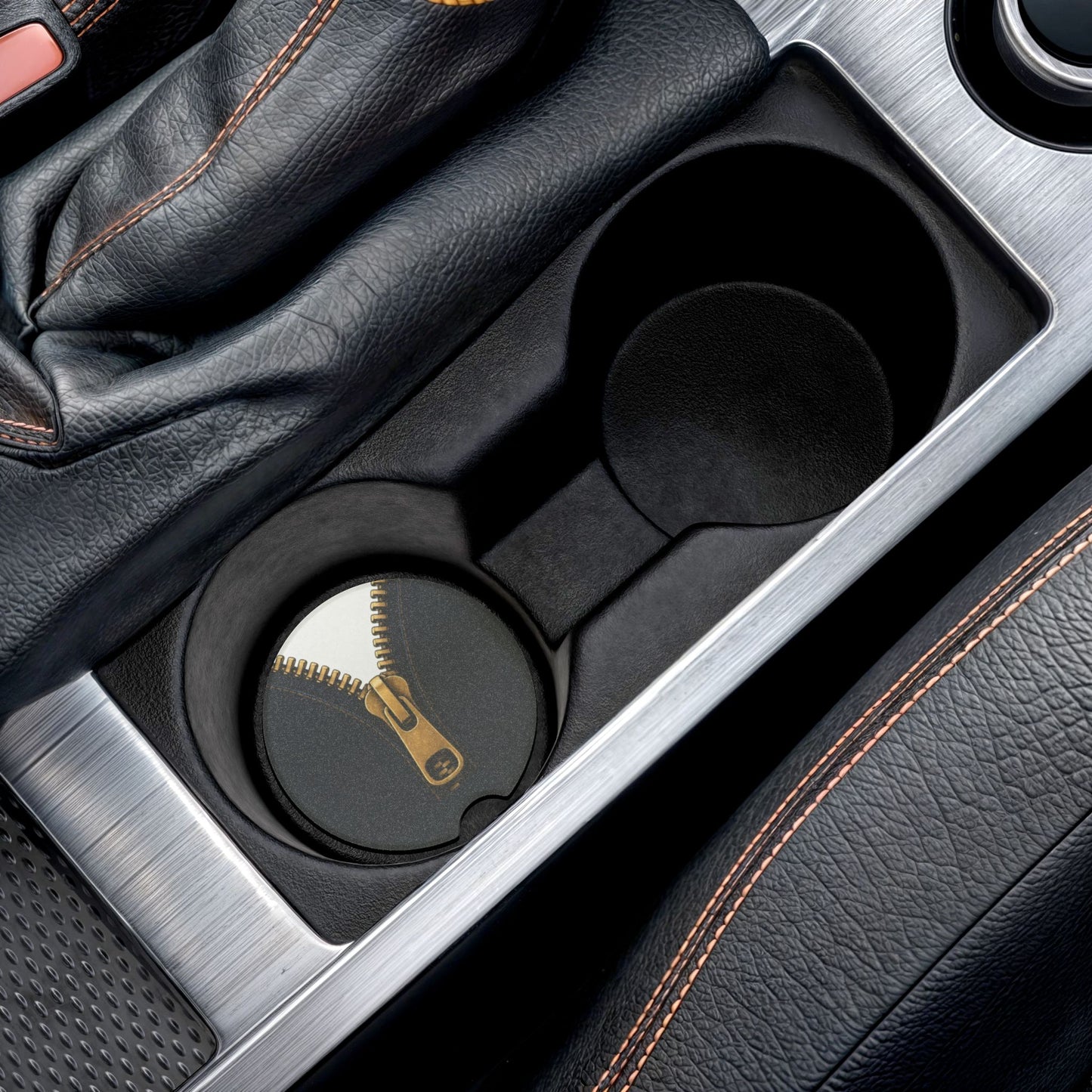 A close-up graphic of a metallic gold zipper opening up dark navy denim fabric - car soapstone coaster